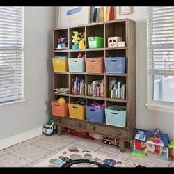 Large wood cubby system with 2 drawers.