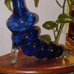 hand-blown glass bottle shaped like a caterpillar or worm