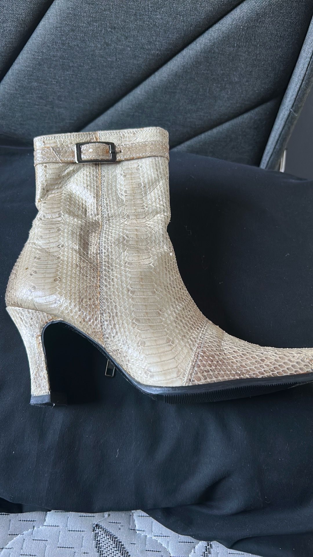 Women’s cream colored snakeskin-print ankle boots