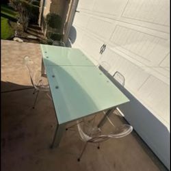glass top dining table with clear chairs