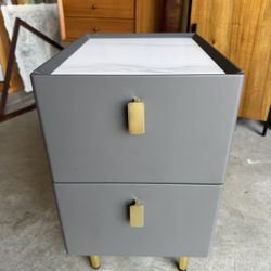 White marble and grey nightstand