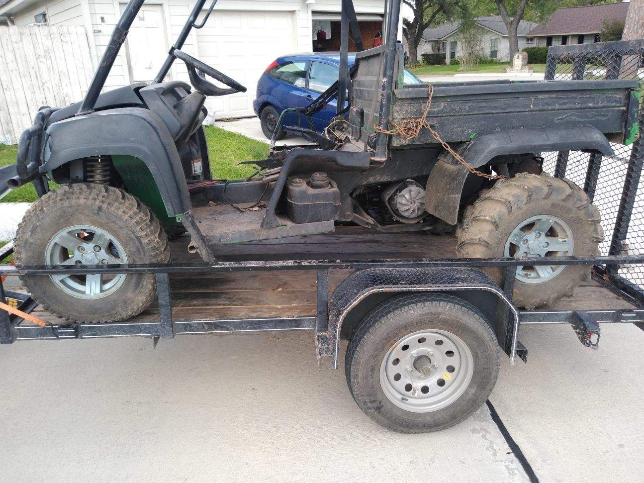 4x4 750 john deere gator 2009 needs work willing to trade for a cheap car or $1400 cash obo