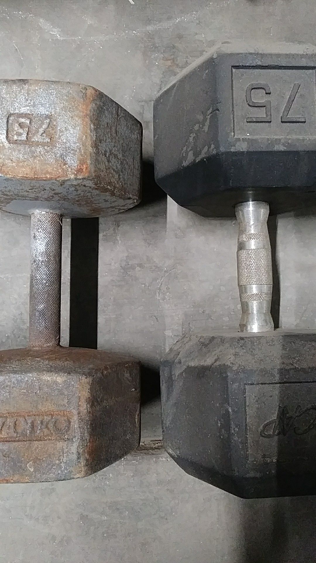 Mismatched set of 75 pound dumbbells