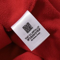 This is a red Jungles Find Truth hoodie with unique screen-printed designs. 