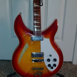 12 string red,orange, and white electric guitar 