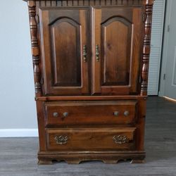 5 Drawer armoire. Tag on back says Walnut but is lightweight