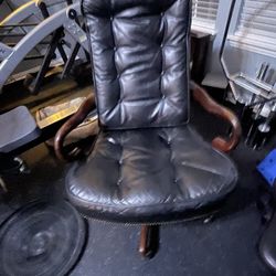 Leather and wood swivel executive desk chair, $40