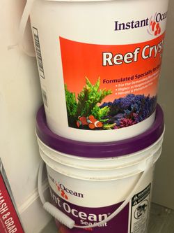 Coral salt and a test kit, plus a small mini-fridge—selling the entire set as a bundle.