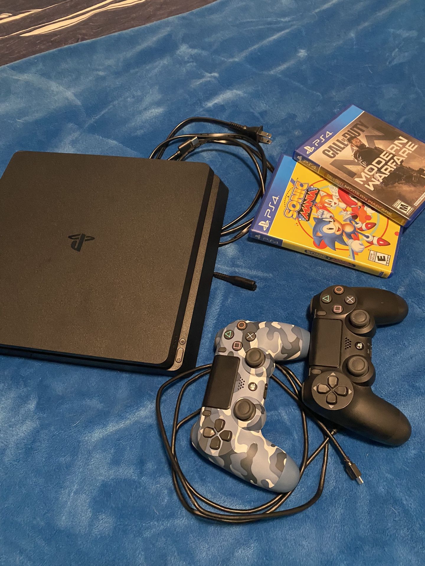 PlayStation 4 Slim 1TB with 2 Controllers And 2 Games