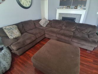 Large brown sectional and ottoman