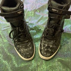 Women’s size 8 iridescent, leather puma high tops