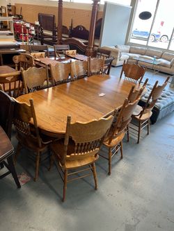 Large oak wood dining table and chairs set (in store)