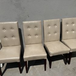 4 Leather Chairs From Pier 1 - Two Of Them Have Visible Wear 