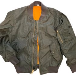 Classic MA-1 flight jacket with reversible orange polyester lining.