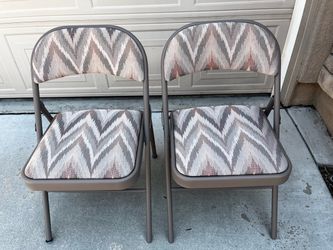 Set of two cloth padded folding chairs