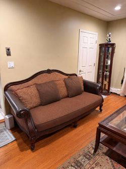 Raymour and Flanigan Sofa set, coffee table and tall glass cabinet
