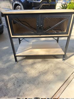 Wooden Aquarium Table with Power Outlet and metal frame.