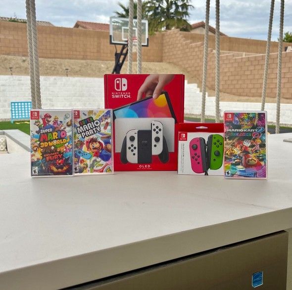 Nintendo switch Oled with extra controller and 3 Mario games Floor Model