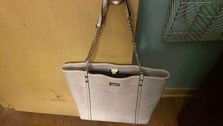 Barely used white leather handbag with metal straps