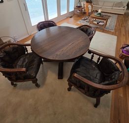 Wood table with leather chairs
