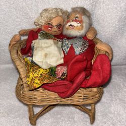 vintage Annalee Mobilitee Mr. and Mrs. Claus doll pair sitting in a wicker love seat Santa