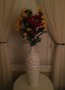 Large vase with flowers.