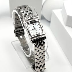 Tommy Hilfiger women watch, 22mm size case, 6.5 size wrist bracelet.