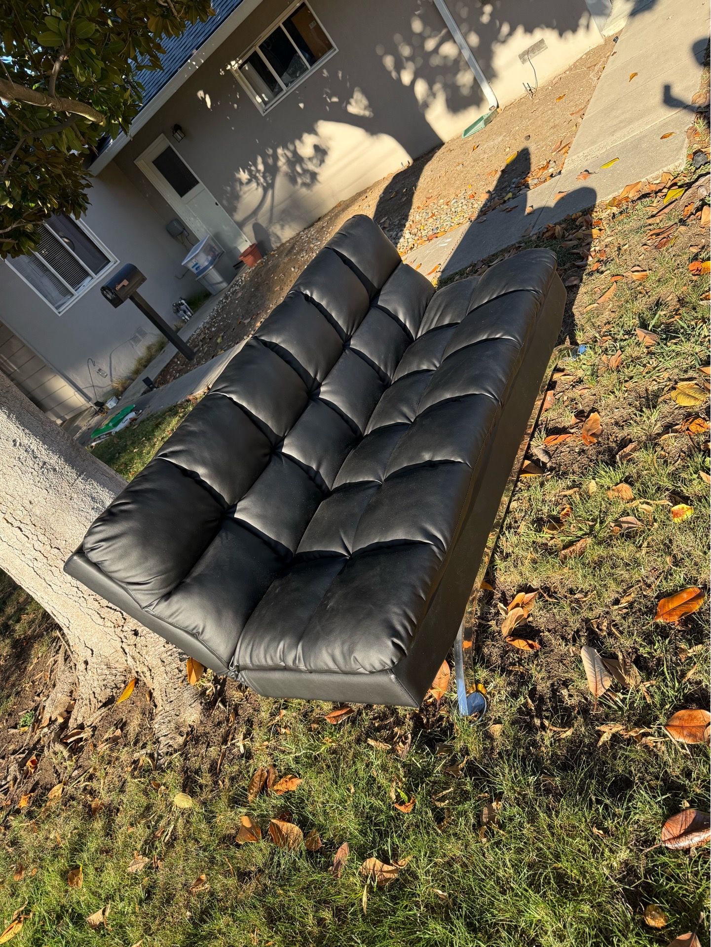 Black faux leather futon