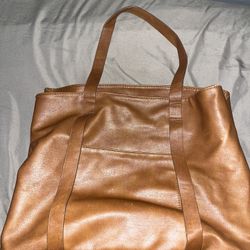 brown leather traveling bag 