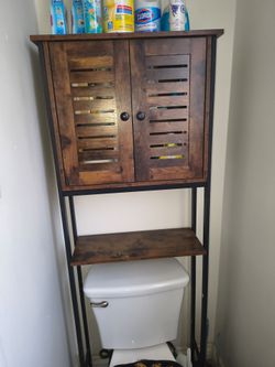 Over the toilet cabinet metal and wood