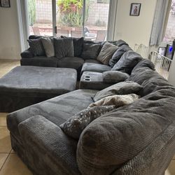 Large Sectional Couch With Piano Wedge, Cup Holders And Oversized Ottoman
