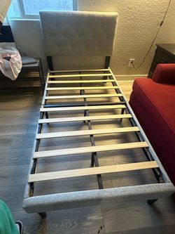 Gray tufted twin bed frame