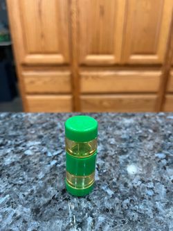 Vintage Cylindrical Green Screw Together 1950s Picnic Salt and Pepper Shakers.  Size appropriately 2 1/4 inches tall.   Preowned.  Has been on display