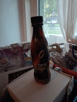 Plastic wrapped Coca-cola Black bottle