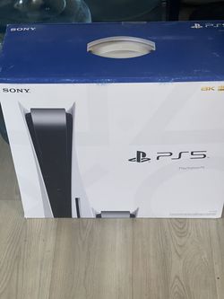 PS5 with two controllers and stand with fan dock