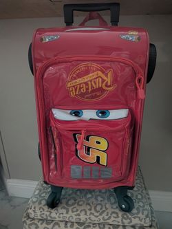 Firm $25 Disney Store Official Lightning McQueen rolling luggage Other Available Items On Account