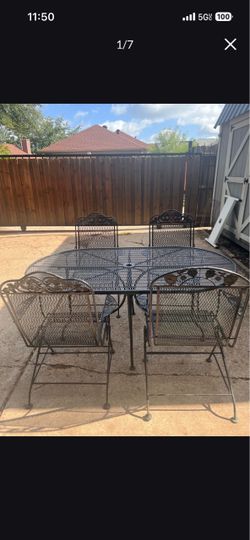 Wrought Iron Patio Set with Oval Table and 4 Rocker Chairs