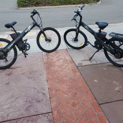 Two Electric Bikes With Throttles Plus Bike Rack
