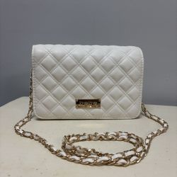 Bebe white quilted crossbody bag with a gold-tone chain strap. 