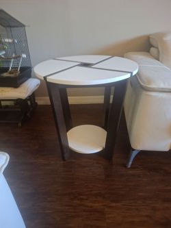 Three living room tables, size 35 inch wide by  17 inch tall  center table ither two table measure 24 in wide by  24 in tall