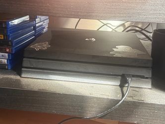 PS4 Pro  w/2 controllers & Choose 3 Games