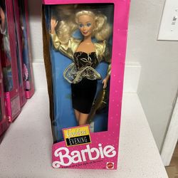 1991 Golden Evening Barbie doll.  The doll was designed and sold exclusively for Target.  It features a black sheath dress with a gold pattern on the 