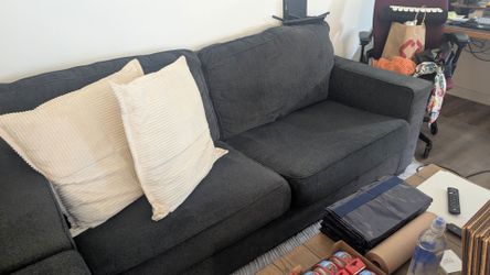 Ashley dark gray 7-ft couch with matching armchair