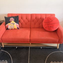 Orange futon couch in Orange County, CA