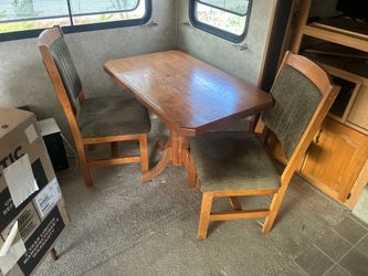 Wooden table with two chairs