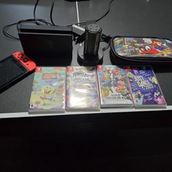 Nintendo Switch W 4 Games, Carrying Case, Chargers.