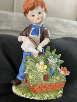 Porcelain Boy Watering The Flower