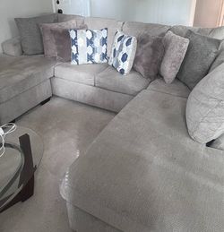 Oversized Gray Sectional Sofa with Matching Ottoman — with throw pillows