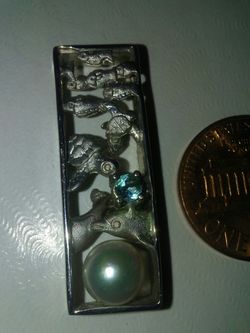 Sterling silver charm. Very nice necklace