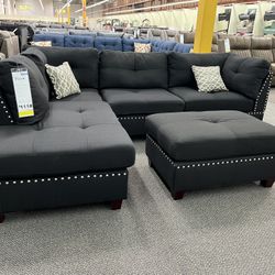 New Reversible Sectional .  Black .  104” X 75”.  Free Delivery !